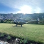 Private Charter Helicopter Air Experience in Devon - Helicopter with Sun in the background